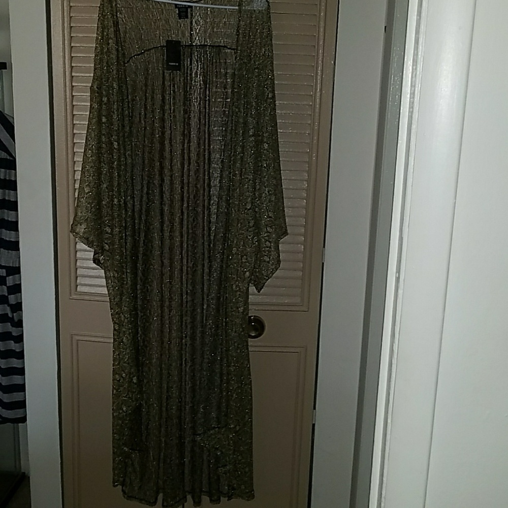 A golden crochet duster